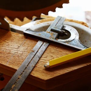 Protective work gear on a workbench representing welding safety equipment
